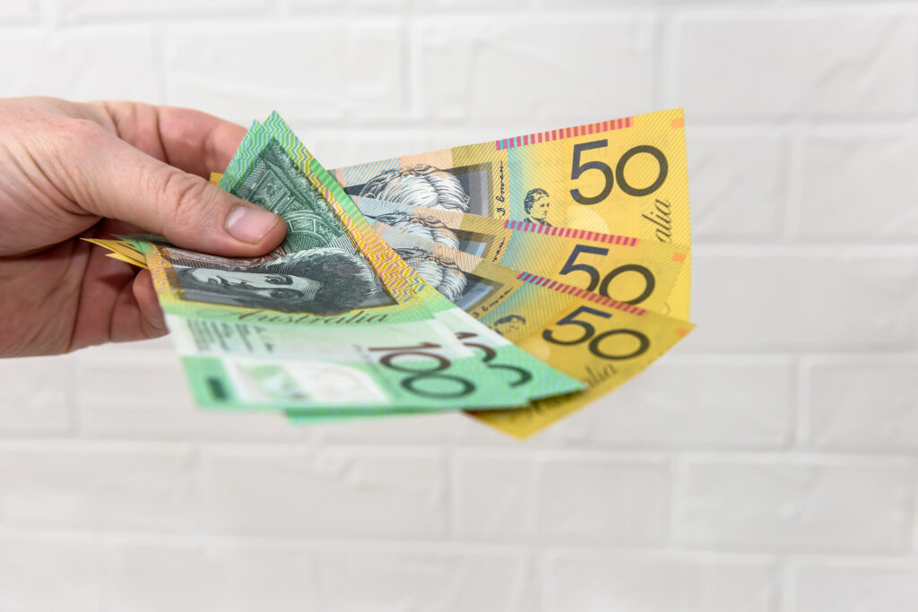 Man receiving cash for his unwanted car.