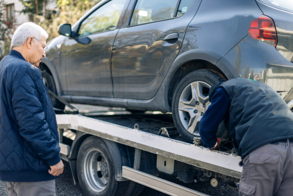 Car being loaded on to removal truck